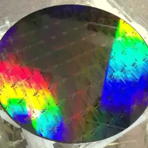 Silicon wafer with rainbow-colored reflective surface.